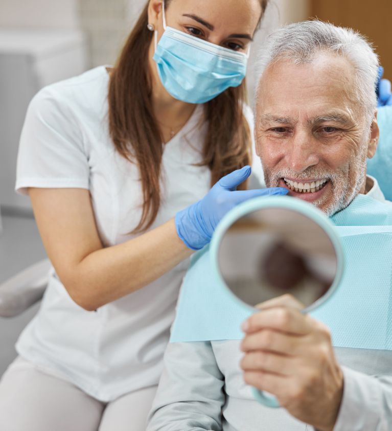 Guy Checking The Teeth After Treatment